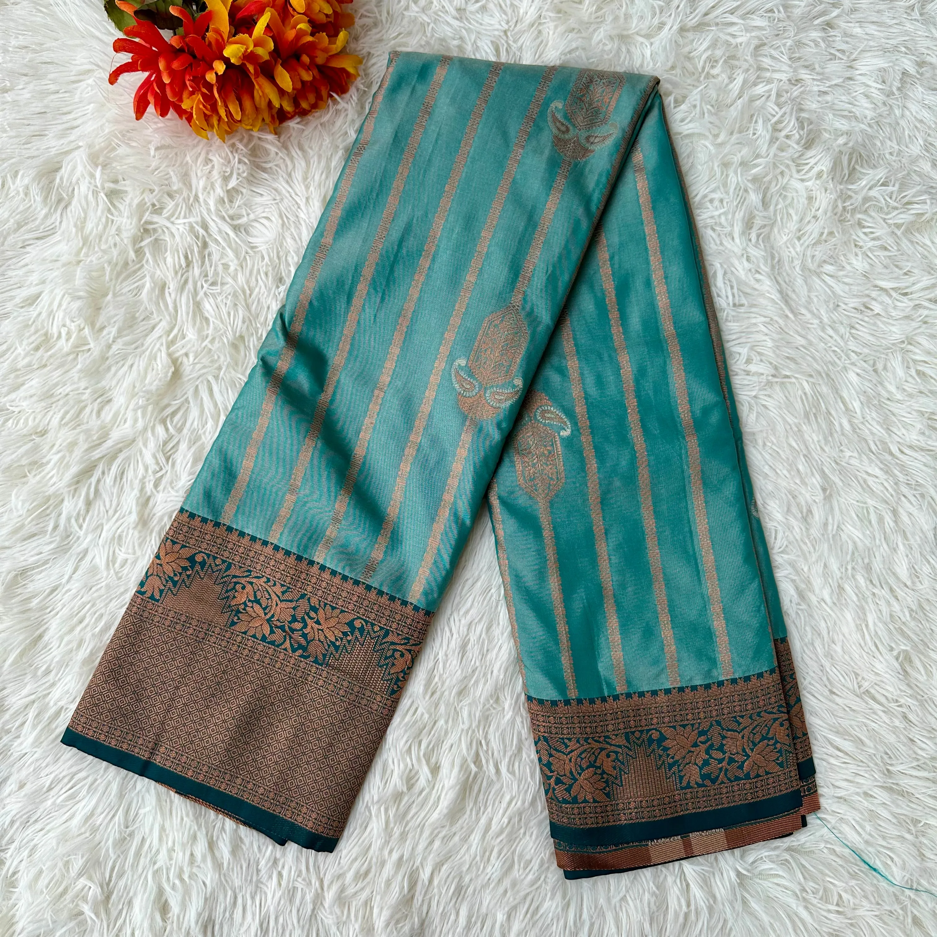 Turquoise Tranquility: Copper Zari Weaved Semi Silk Saree